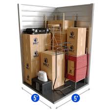 5x5 small storage unit filled with moving boxes and small furniture